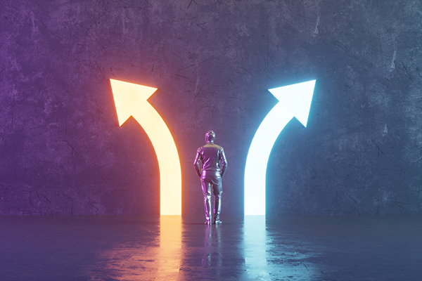 Choices concept with neon arrows in dark room