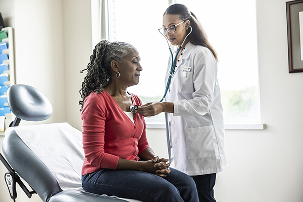 A woman having a health check up, Getty
