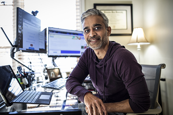 Investor sitting at his screen, Getty