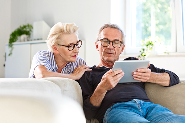 Couple reading about pensions and IHT