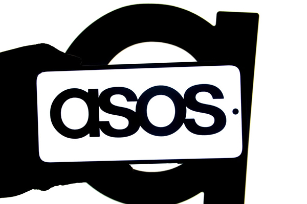 An ASOS logo seen displayed on a smartphone, Getty