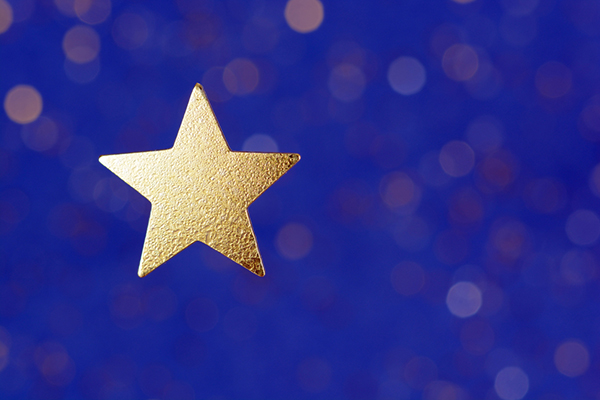Gold star on navy background