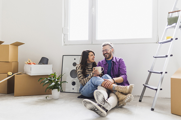Couple enjoying a coffee while moving into their new home