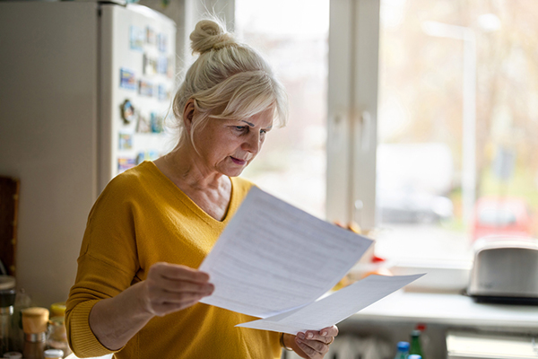 Retired woman looking at finances