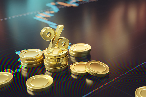 Golden coins and per cent symbol on financial chart