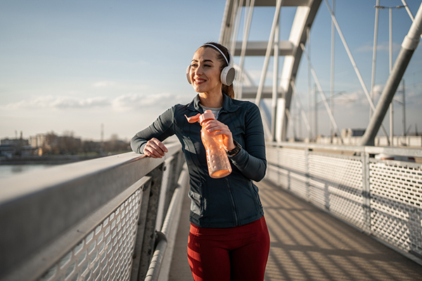 Woman drinking out of water bottle
