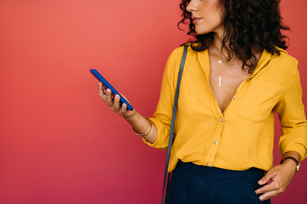 Woman staring at specialist funds on her smartphone