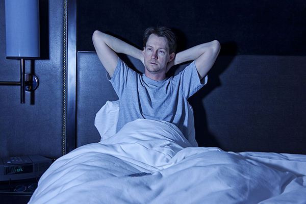 Fund manager sitting up in bed