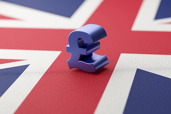 A blue pound sign against Union flag, Getty