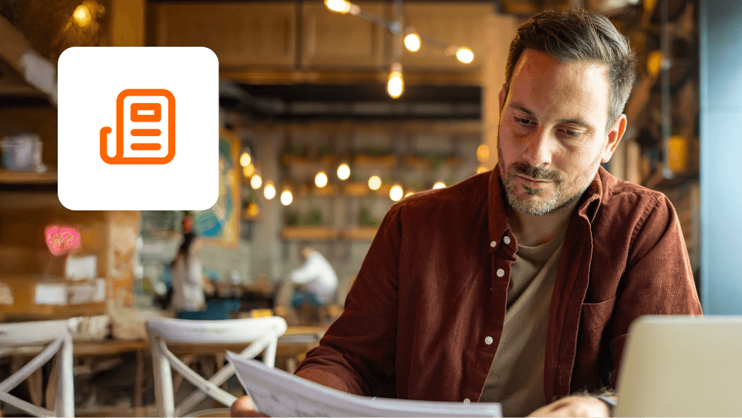 An image of a man reading research report