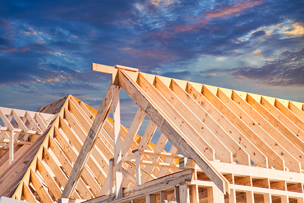Wooded frames of new residential houses at sunset