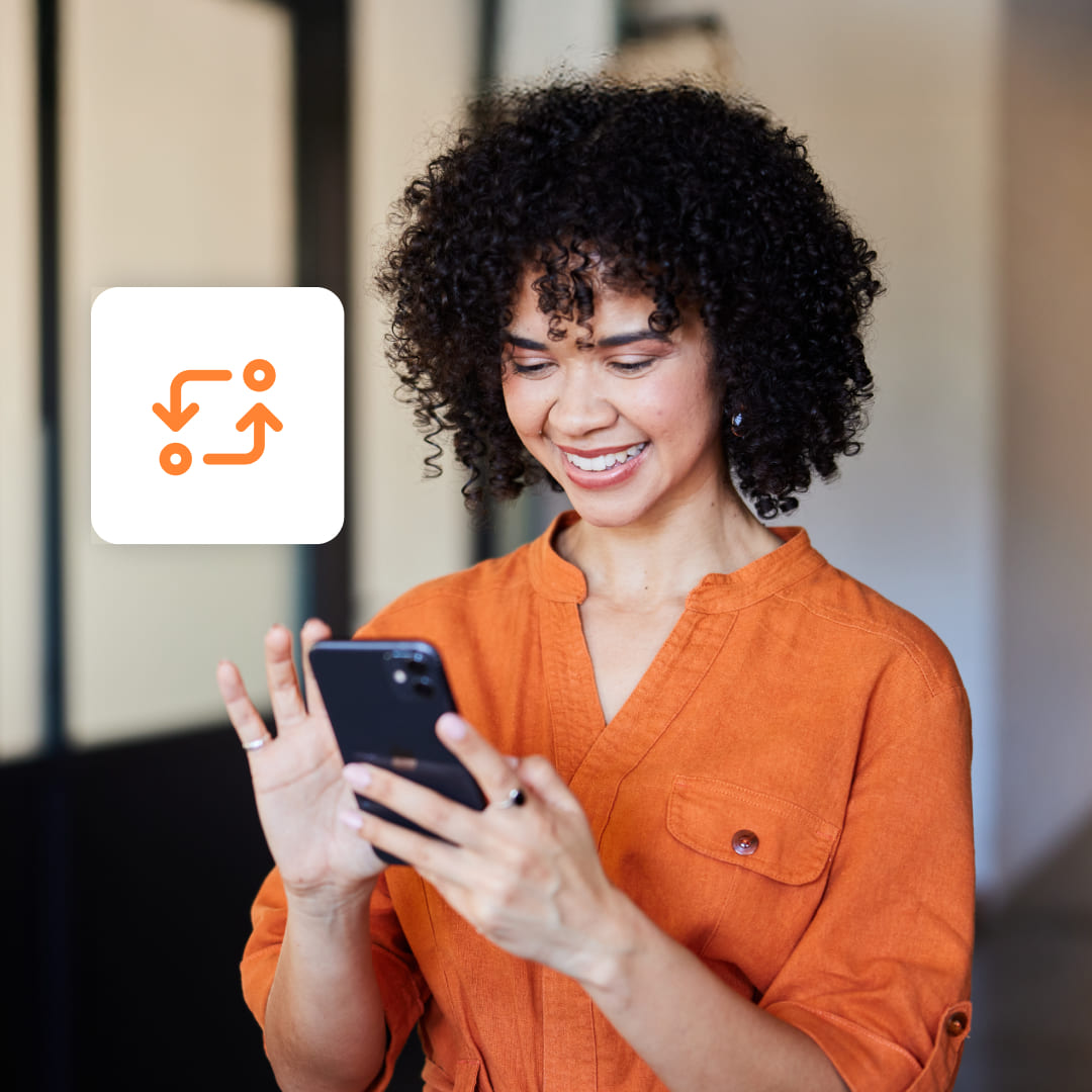 An image of a woman in orange shirt using her phone. The image also has a dividend reinvestment icon