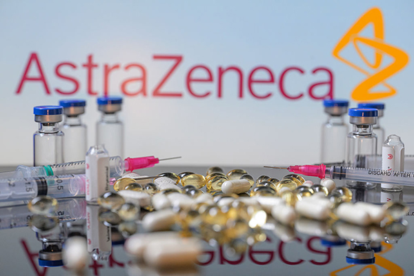AstraZeneca logo, tablets and syringes, Getty