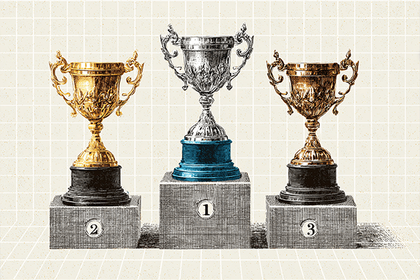 Finimize silver trophy above gold cups on a podium