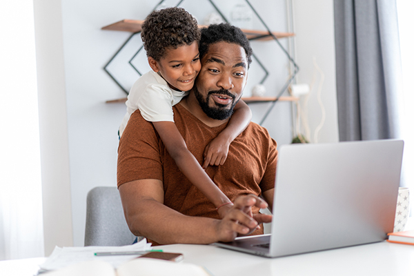 Father working at home with son