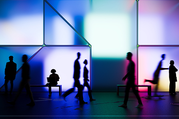 Glowing building with people silhouetted