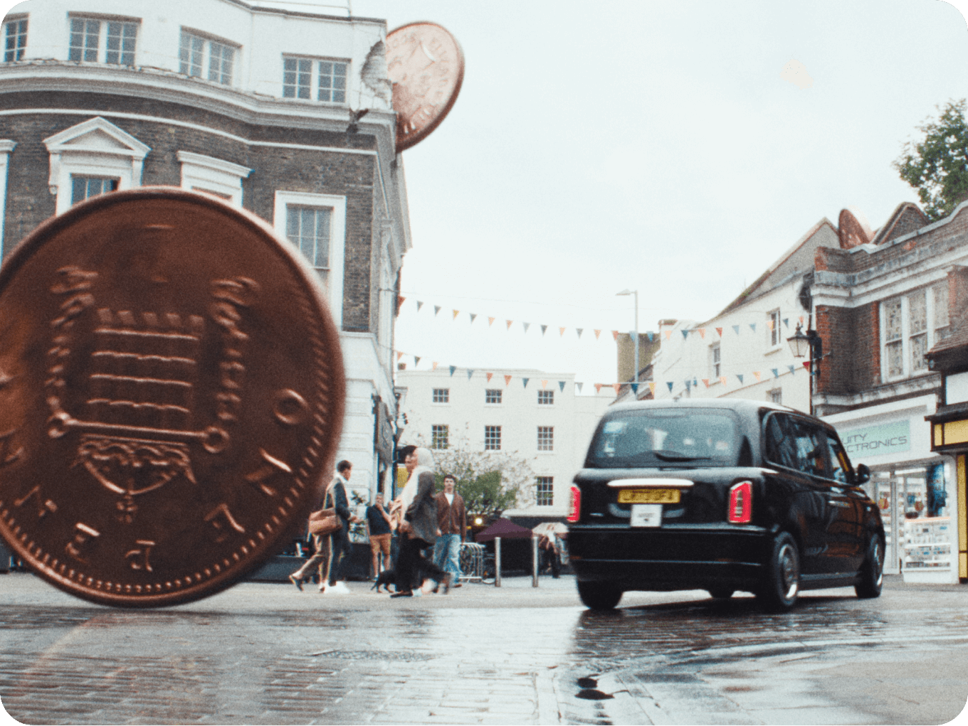 An image showing a falling penny in London city centre