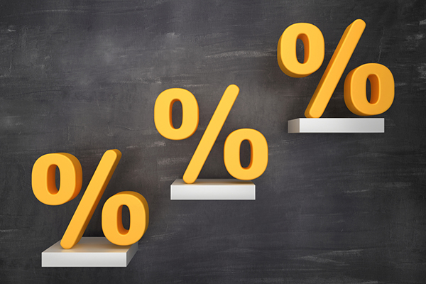 Three yellow per cent signs on ledges