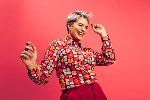 Lively and happy woman dancing