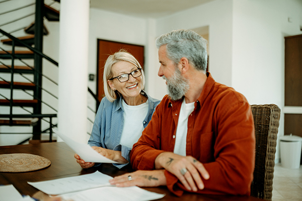 Older couple discussing IHT and CGT and gifting wealth