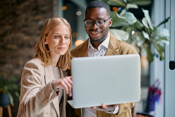 Two people looking at a computer screen