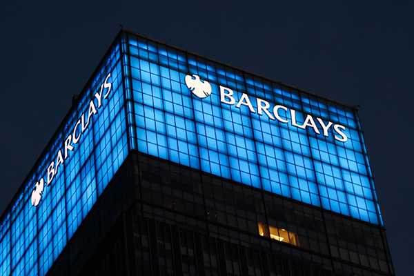Barclays logo on bank building in New York, Getty