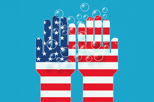 Soap bubbles and hands with US flag on, Getty