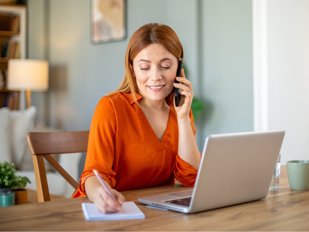 An image of a woman reviewing her savings and investments