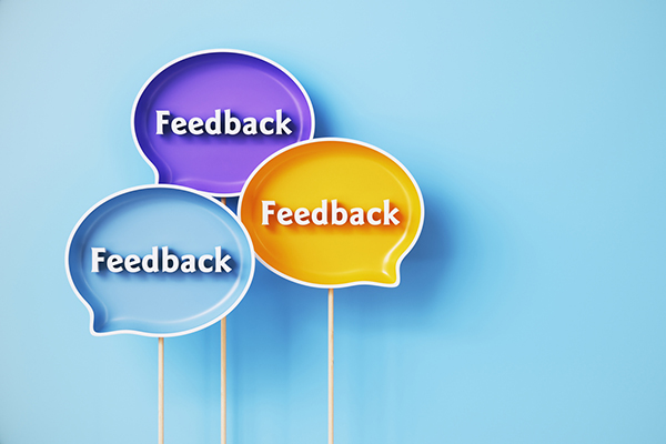 Three feedback bubbles on a blue background