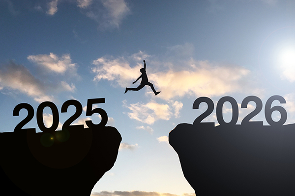 Man jumping from 2025 cliff to 2026 cliff