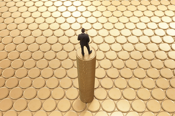 A man surveying a sea of coins representing dividends