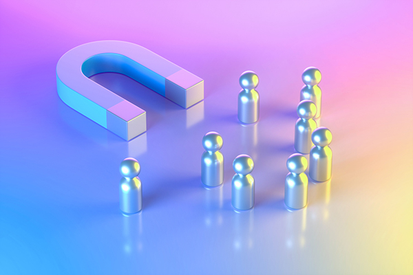 Magnet attracting pawns on a neon background