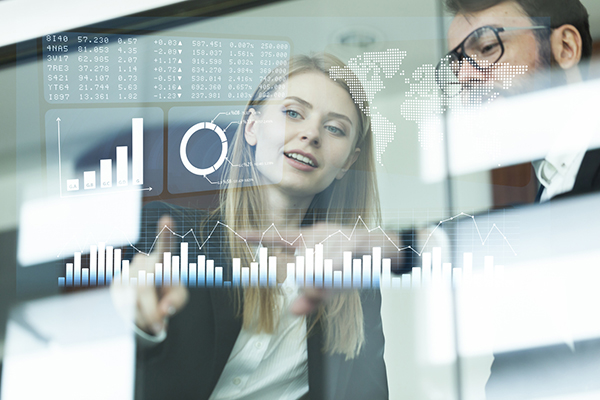 Busines couple discussing business figures on a modern interface with world map