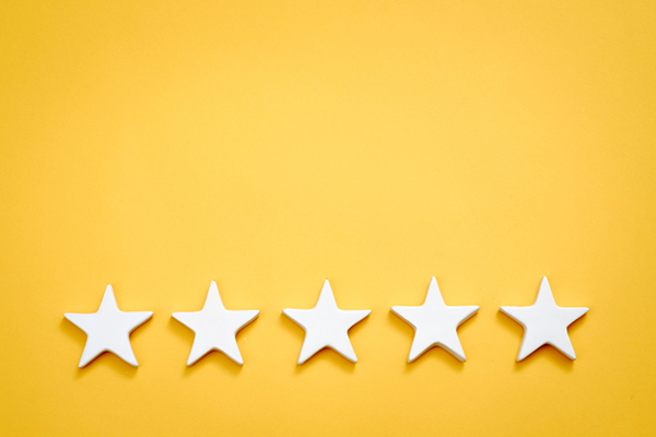 Five golden stars on yellow background