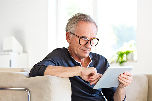 A man reading a tablet