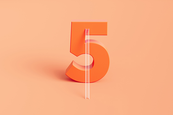 Orange five with a ladder against it