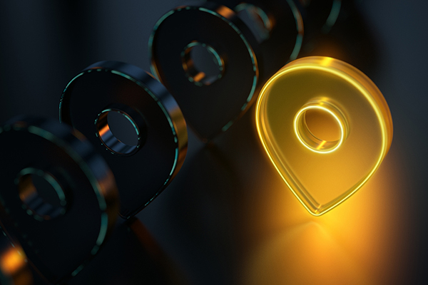 A yellow GPS marker against a black background