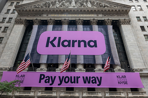 Klarna banner on the New York Stock Exchange building, Getty