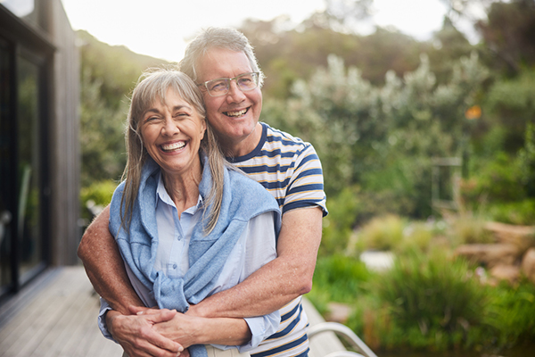 Couple with arms around each other