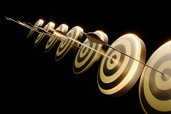 Gold arrows hitting bull's eye targets on black background