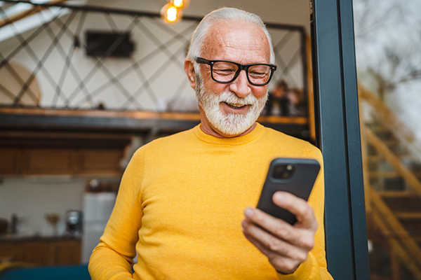 Investment trust investor looking at his investments on a phone