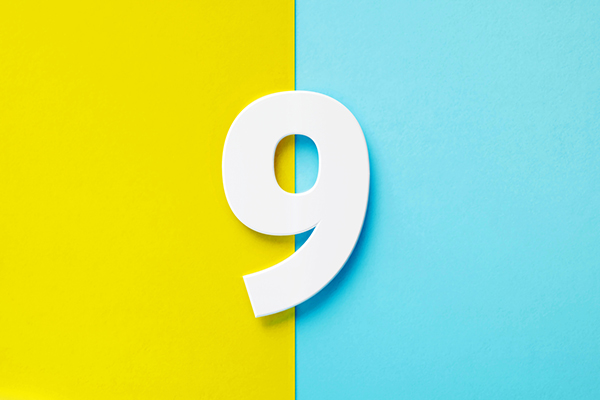 White number nine against a blue and yellow background