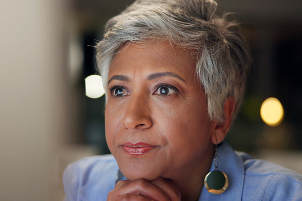 Woman looking at share on a computer screen