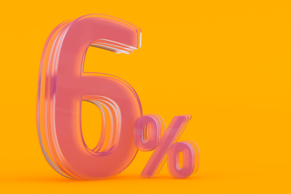 Pink 6% sign against an orange background