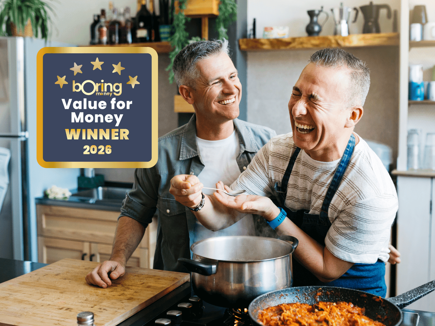 two men cooking dinner in kitchen whilst laughing Boring Money awards