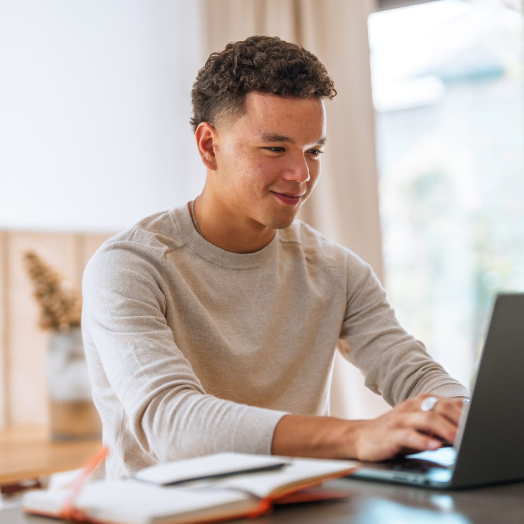 Young man looking at laptop