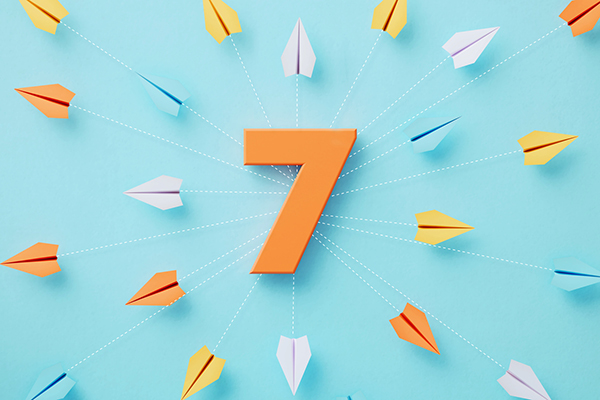 Orange number seven against blue background