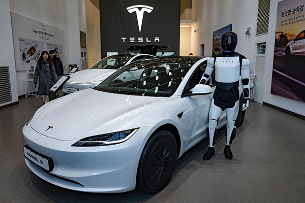 Tesla car and robot, Getty
