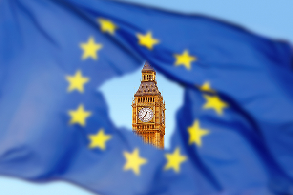 Big Ben seen through hole in EU flag