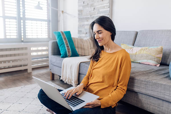 Woman working on laptop at home
